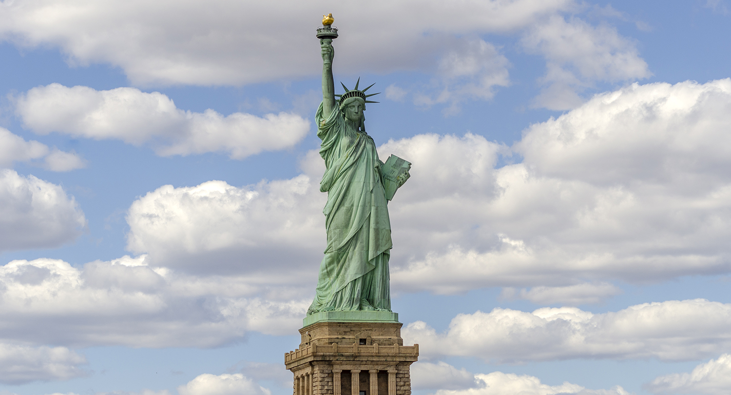 Lady Liberty Beneath the Passing Clouds