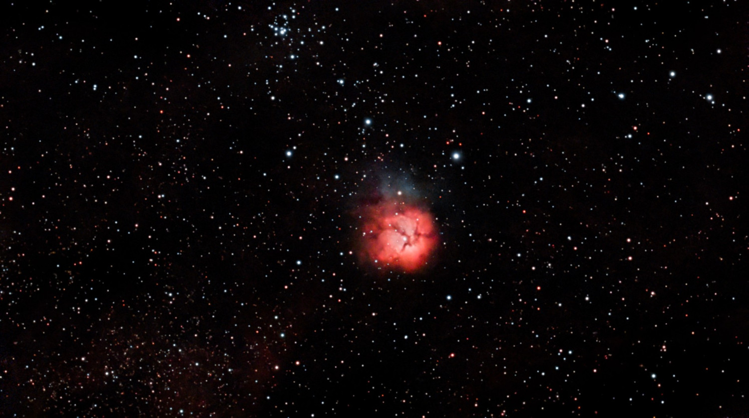 Trifid Nebula - A Crimson Glow Among the Stars